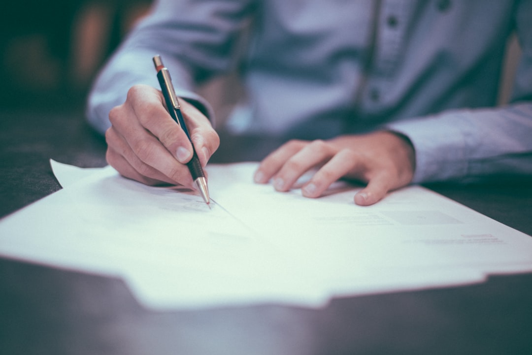 Senior discussing health and insurance documents with a professional